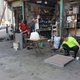Image for article titled The Most Dedicated Mechanics In The World Wrench On The Streets Of Hong Kong